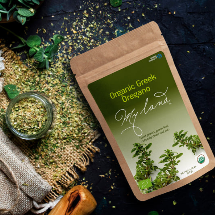 My land greek oregano placed next to a linen traditional bag of oregano