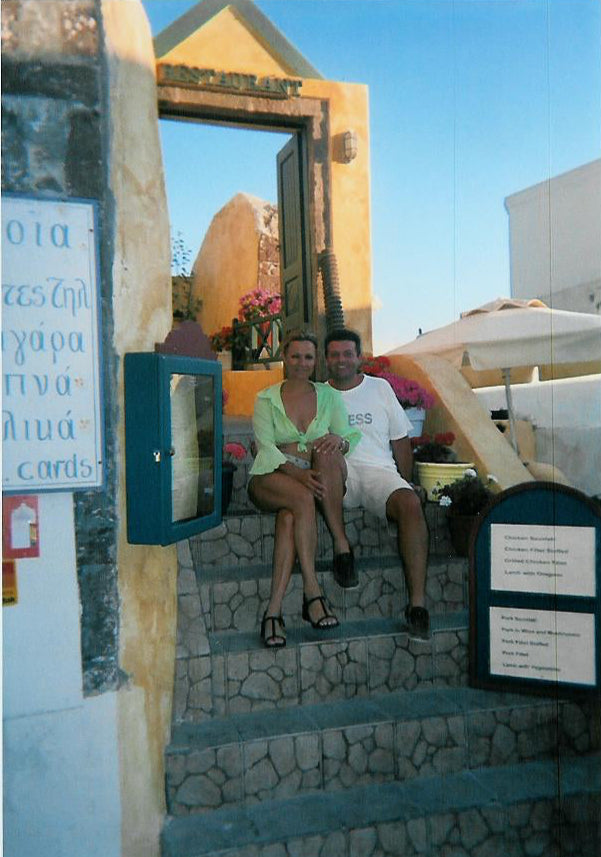 My Land Brand founders Christina and George in a tavern in Santorini Greece 